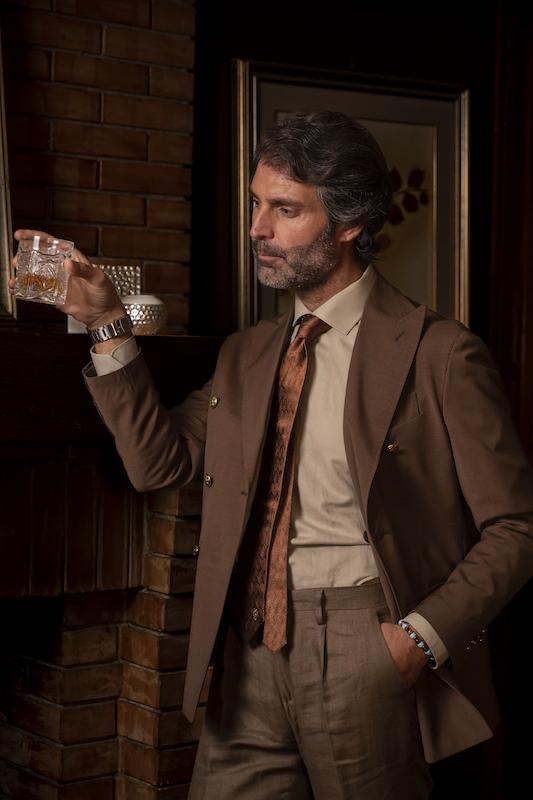 Miliari Cigars Limited Edition Pure silk tie and a model drinking scotch